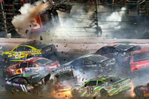 DAYTONA BEACH, FL - JULY 06:  Austin Dillon, driver of the #3 Bass Pro Shops Chevrolet, is involved in an on-track incident following the checkered flag during the NASCAR Sprint Cup Series Coke Zero 400 Powered by Coca-Cola at Daytona International Speedway on July 6, 2015 in Daytona Beach, Florida.  (Photo by Patrick Smith/Getty Images)